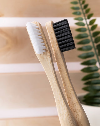 Smilebite bamboo toothbrush with white nylon bristles, suitable for vegans